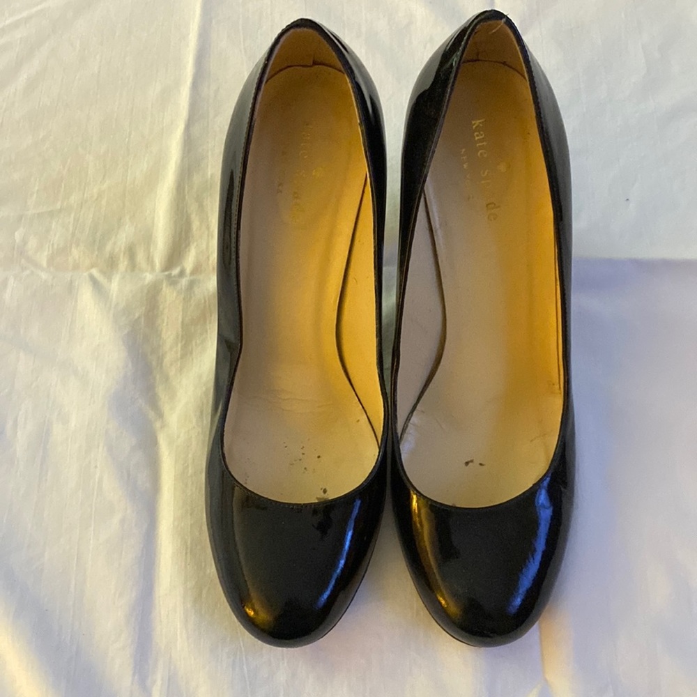 Black patent pumps by Kate Spade. A classic for your closet. 3” heel